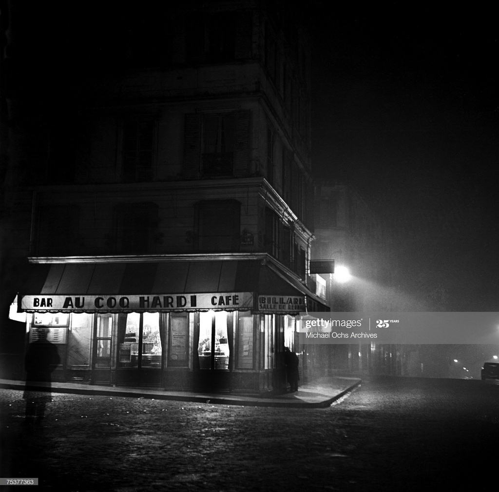 Exterior of the Au Coq Hardi bar and cafe on a foggy street at night on November 1 1948 in Paris, France. (Photo by Michael Ochs Archive/Getty Images)